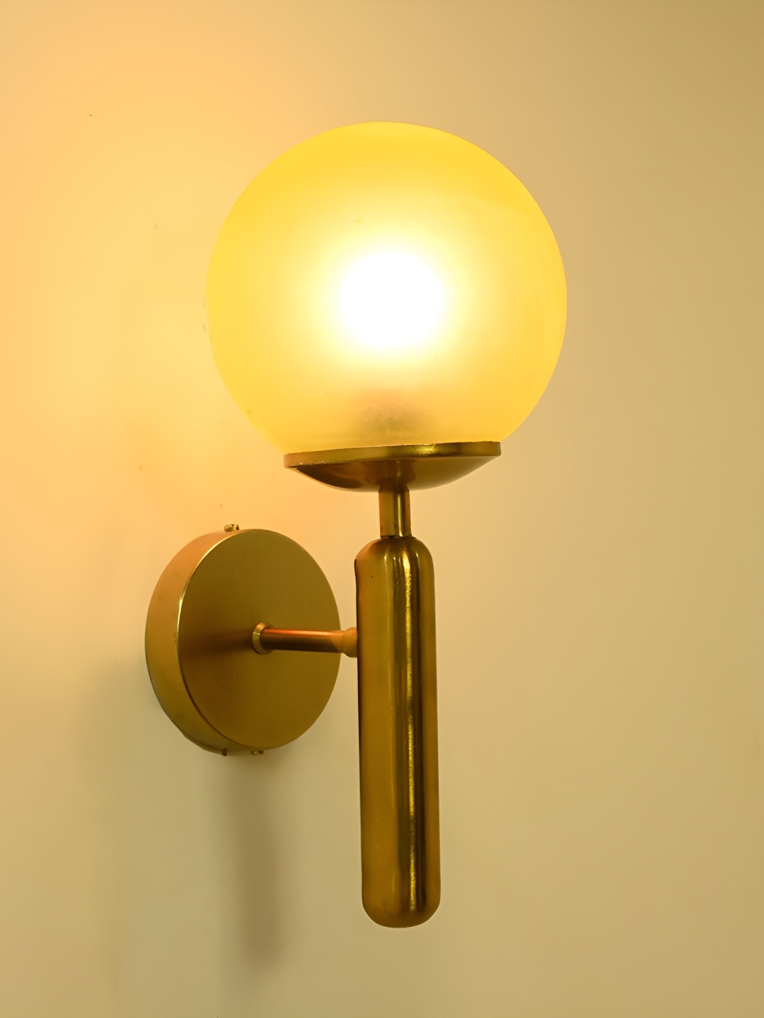 

Afast Yellow & Gold Toned Glass Contemporary Spherical Shaped Wall Lamp