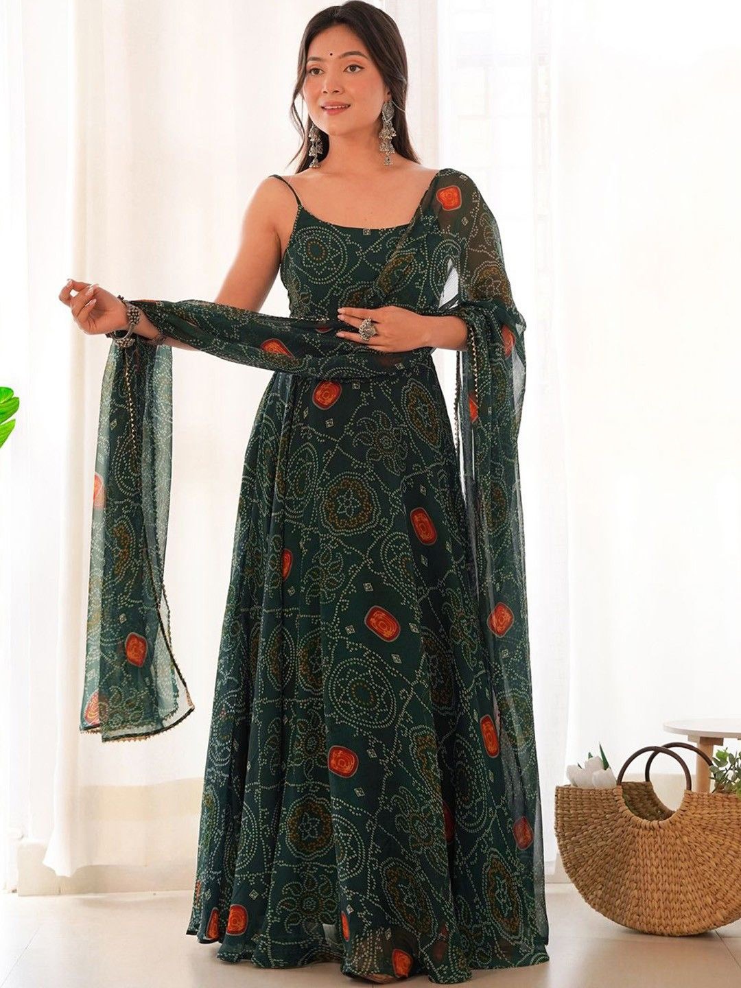 

CaniBani Bandhani Printed Shoulder Straps Sleeveless Anarkali Kurta With Trouser & Dupatta, Green