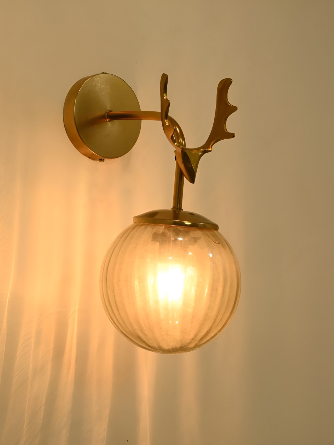

Afast Gold-Toned Glass Traditional Spherical Shaped Wall Lamp