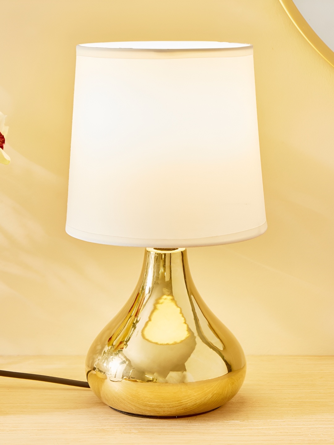 

Home Centre Glint Regal Gold-Toned Ceramic Contemporary Frustum Shaped Table Lamp