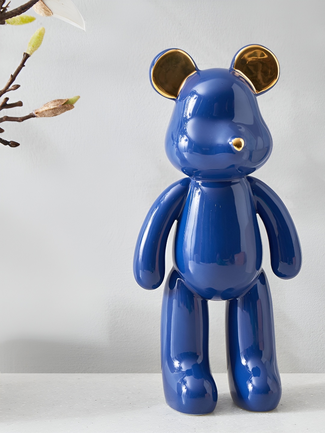 

Home Centre Thames Aero Blue & Gold Toned Teddy Figurine Showpiece
