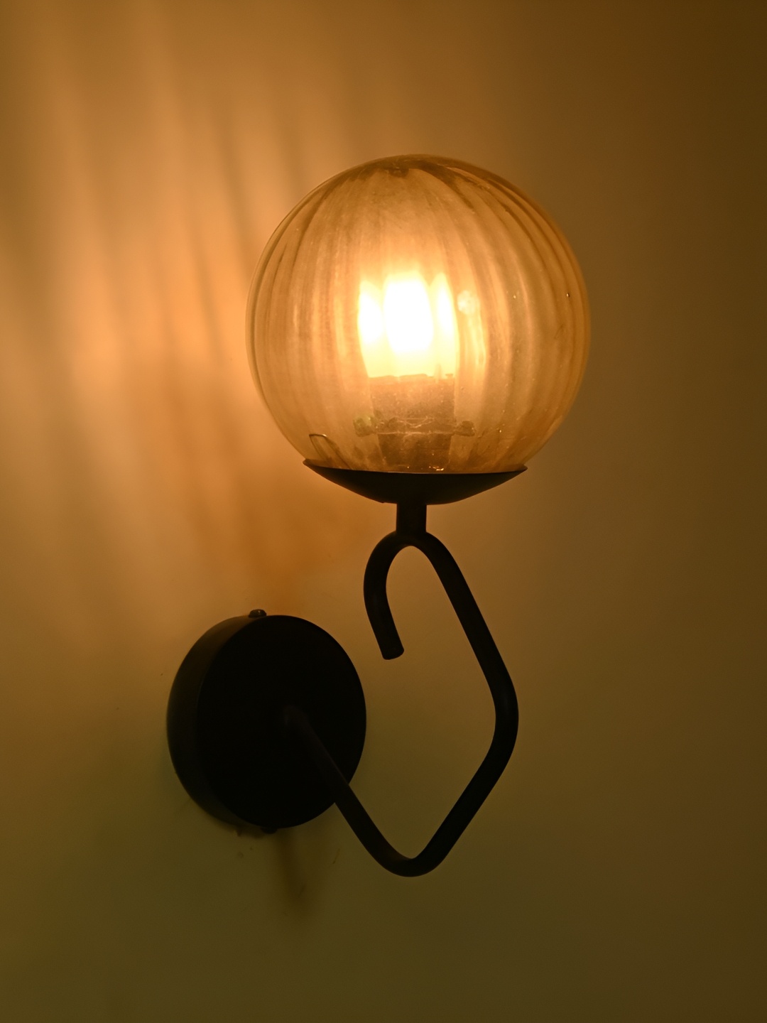 

Afast Gold-Toned Glass Traditional Spherical Shaped Wall Lamp