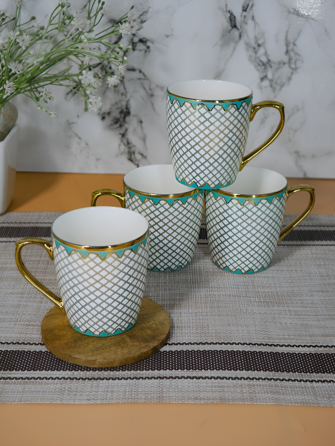 

Femora Gold-Toned & Teal Blue 4 Pieces Geometric Printed Ceramic Glossy Cups