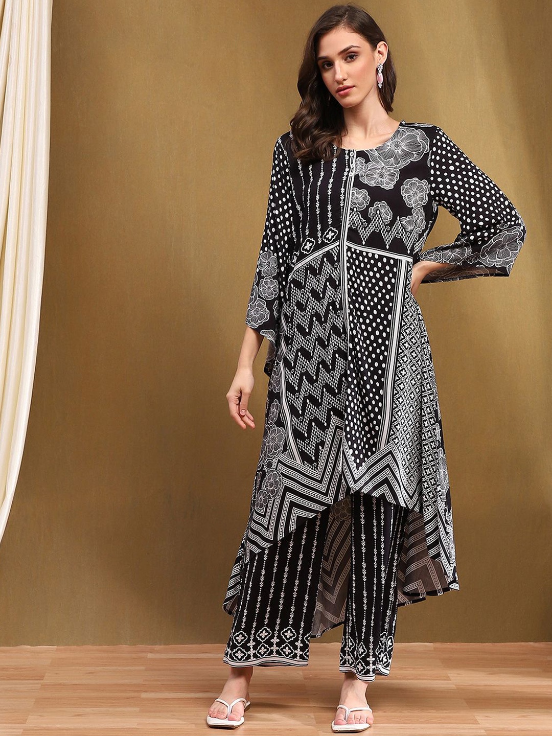 

Biba Floral Printed Flared Sleeves High Slit A-Line Kurta with Palazzos, Black