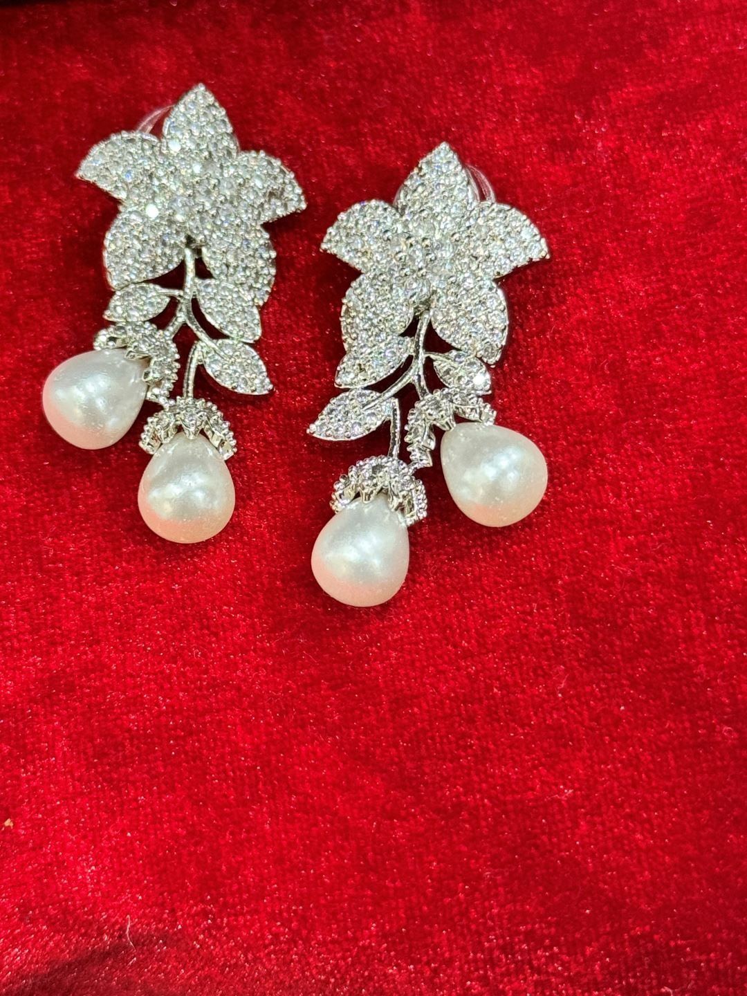 

The Jewellery Tale Silver Plated American Diamond Studded Floral Drop Earrings, White