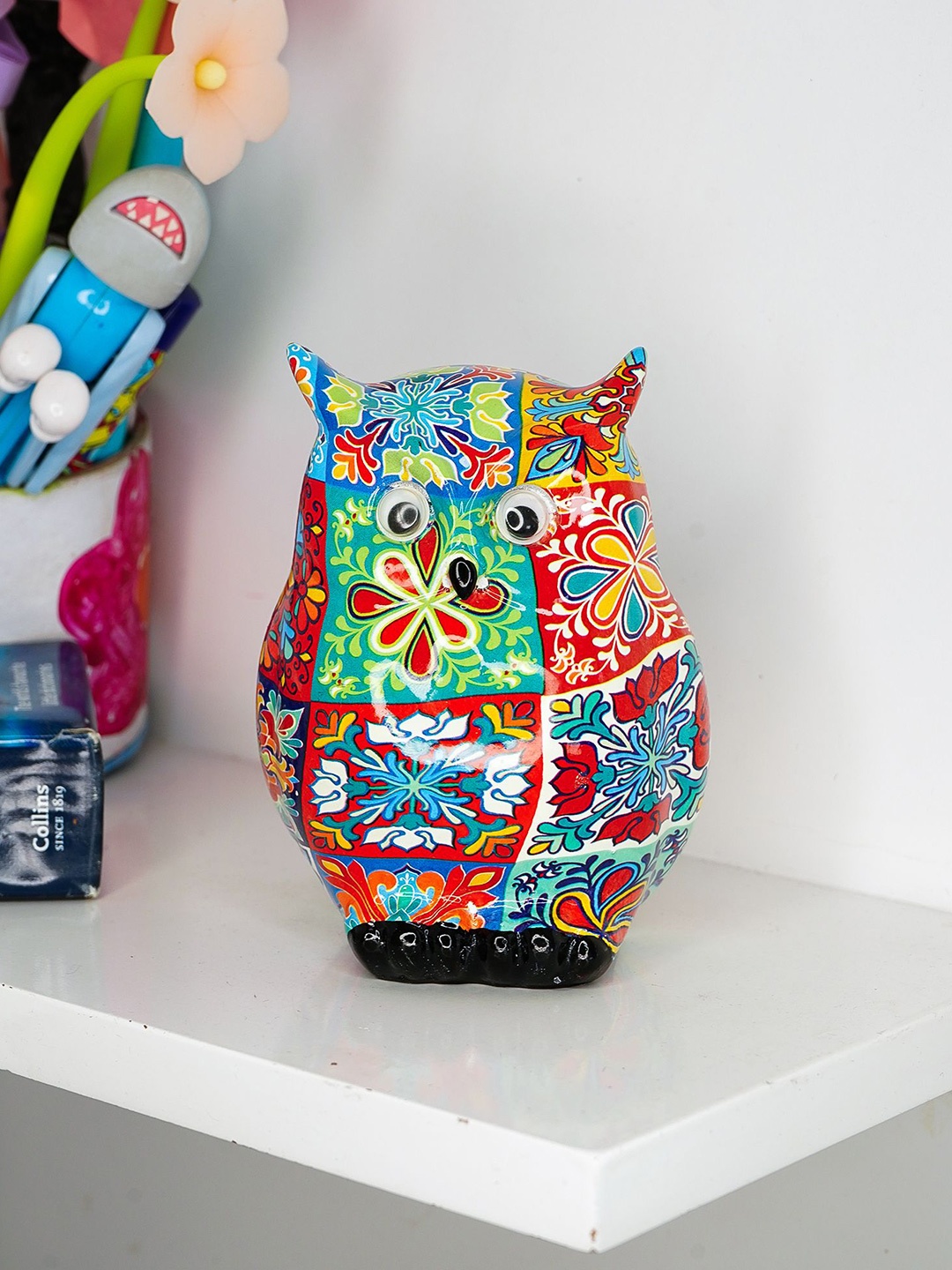 

Ekhasa Red & Blue Printed Owl Figurine Showpiece
