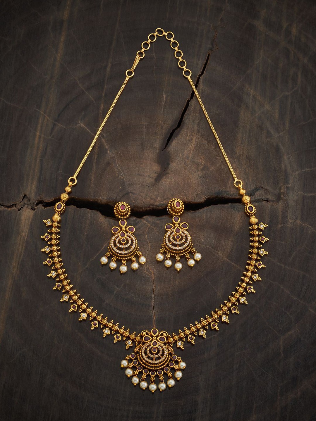 

Kushal's Fashion Jewellery Gold-Plated Stone Studded & Beaded Antique Jewellery Set