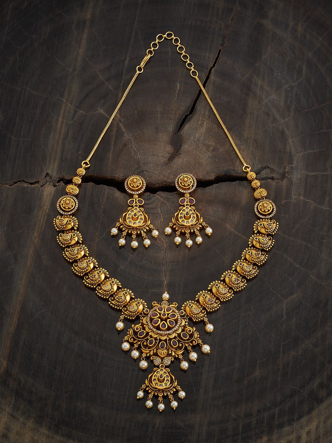 

Kushal's Fashion Jewellery Gold-Plated Stone Studded & Beaded Temple Jewellery Set