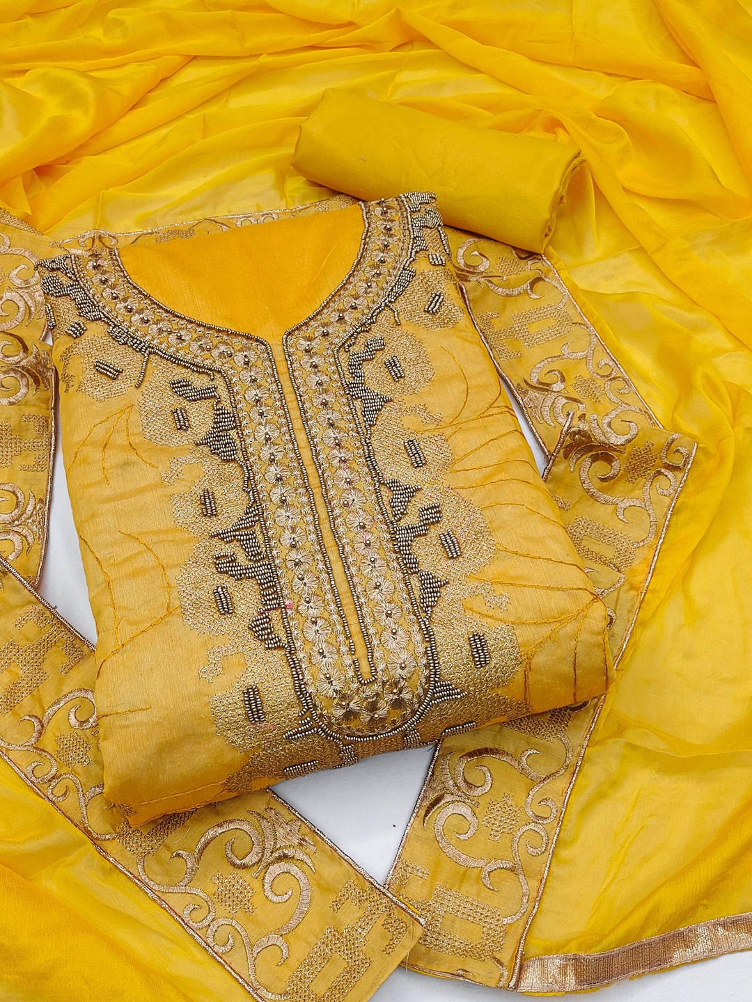 

Ishin Ethnic Motifs Embroidered Beads and Stones Unstitched Dress Material, Yellow