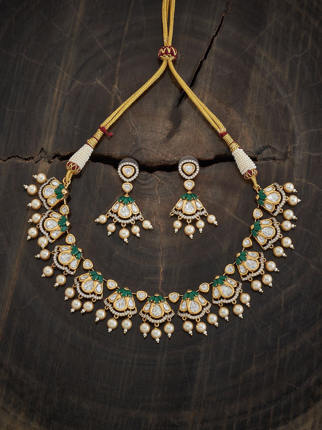 

Kushal's Fashion Jewellery Ruby Kundan Stone Studded & Beaded Jewellery Set, Gold