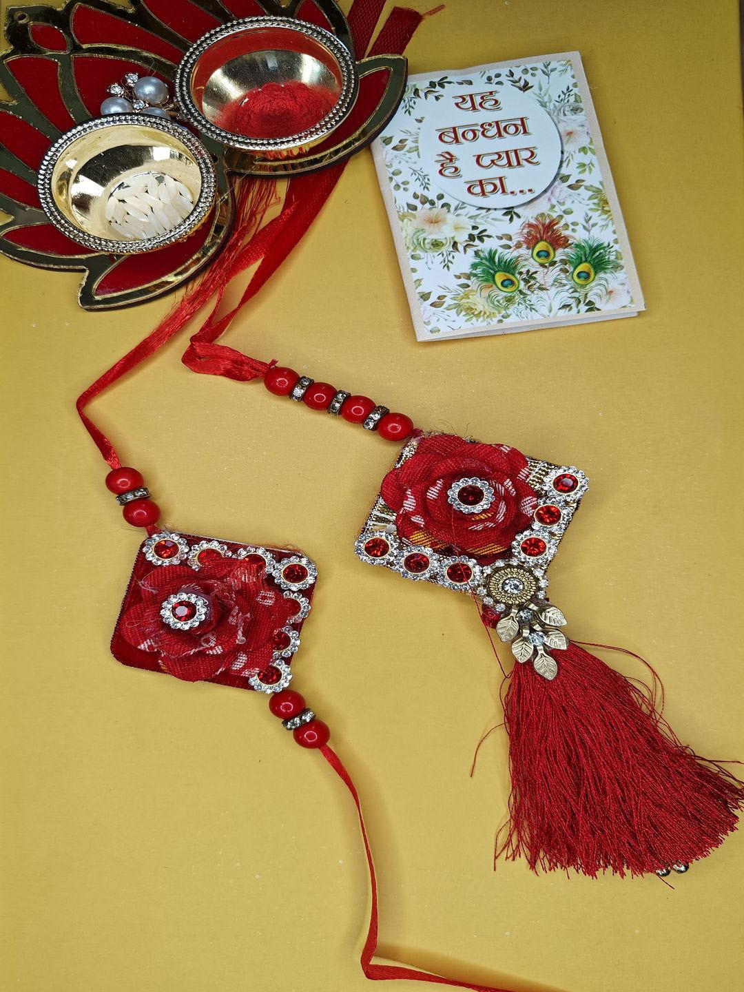 

NVR Set of 2 Stone-Studded Bhaiya Bhabhi Rakhi With Roli Chawal, Red