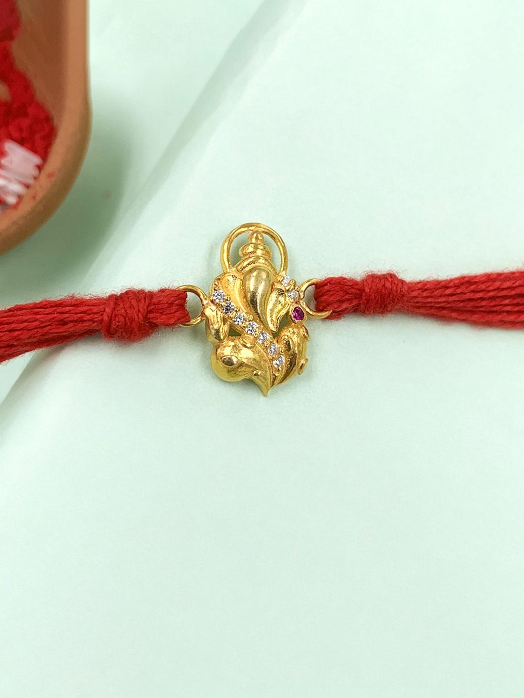 

Unniyarcha 92.5 Sterling Silver Ganesha Thread Rakhi, Gold