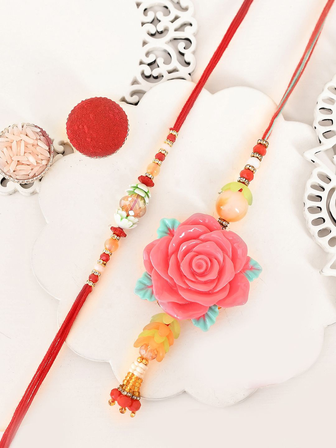 

Aapno Rajasthan 2-Pcs Bhaiya Bhabhi Rakhi With Roli Chawal & Greetings Card, Pink