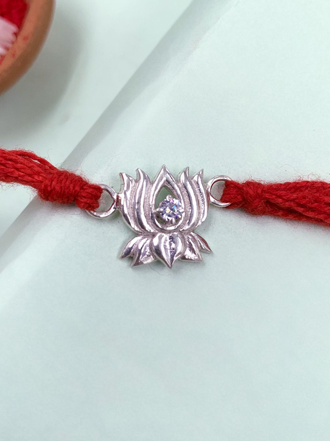 

Unniyarcha Thread Rakhi, Silver