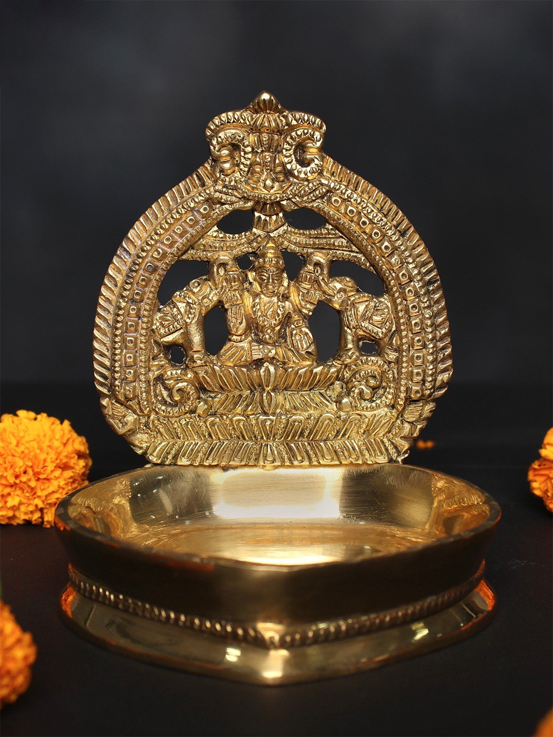 

Exotic India 5" Small Gajalakshmi Lamp In Brass, Gold