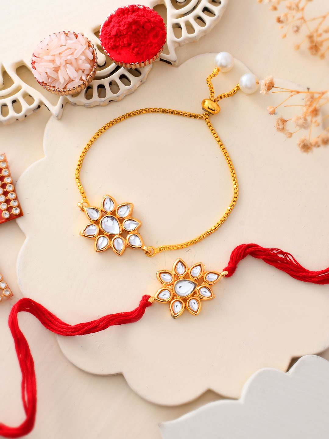 

Shoshaa Gold-Plated Kundan Floral Shape Thread Bracelet Bhaiya Bhabhi Rakhi