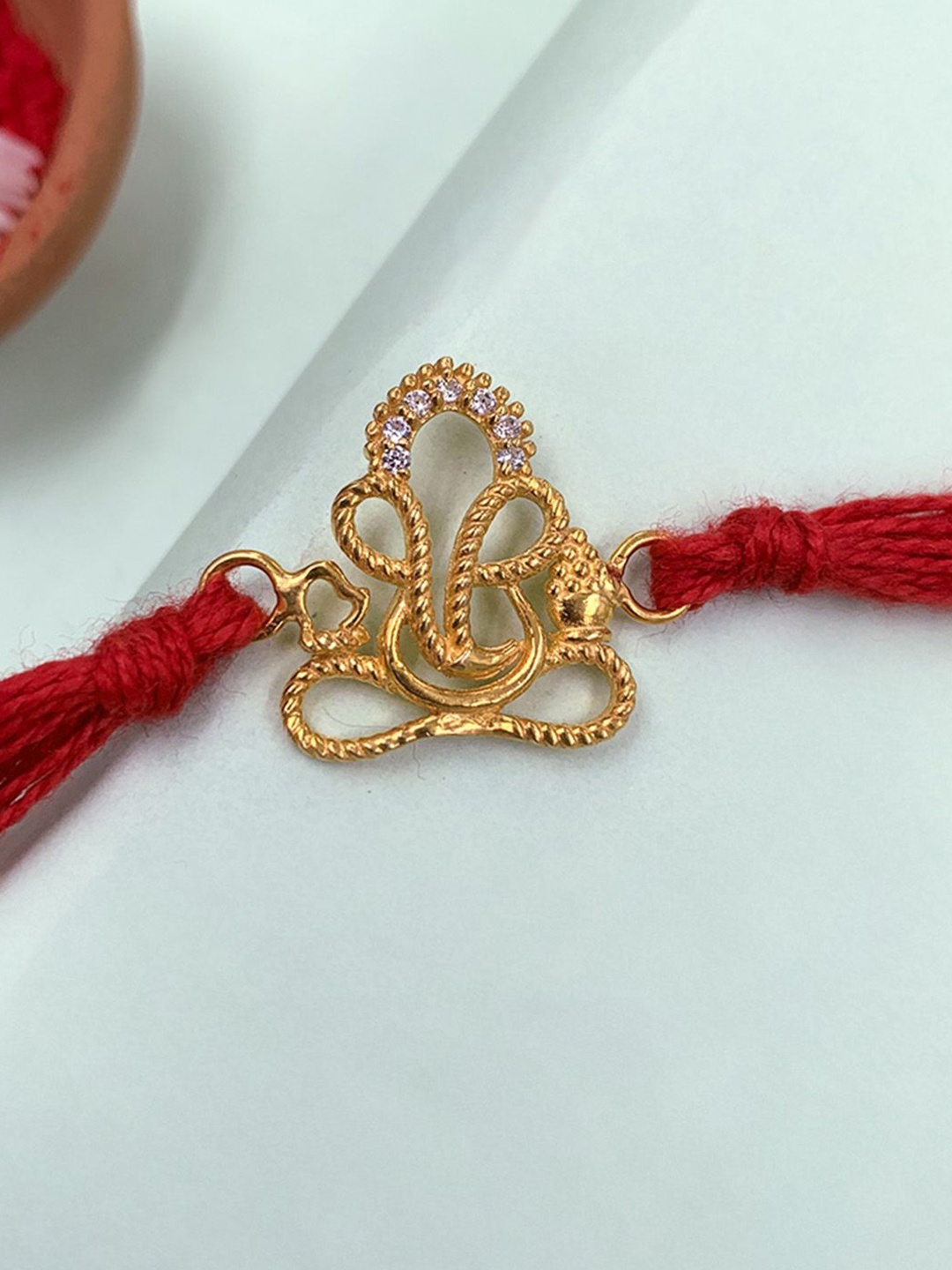 

Unniyarcha Pure 92.5 Silver Gold Plated Lord Ganesha Thread Rakhi, Red