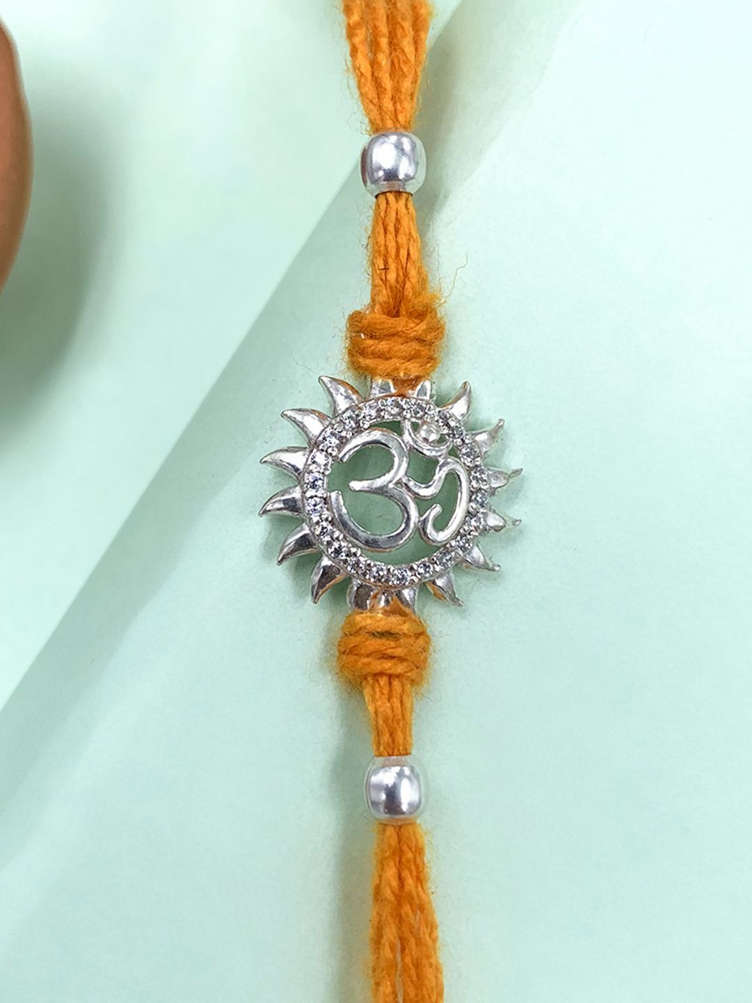 

Unniyarcha Pure 92.5 Traditional Om Silver Rakhi