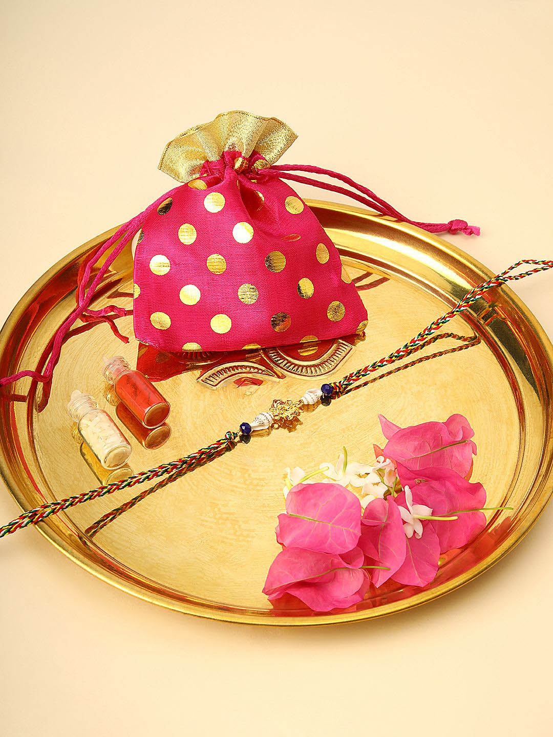 

Anouk Red Gold Plated Ganesha Charm Thread Rakhi