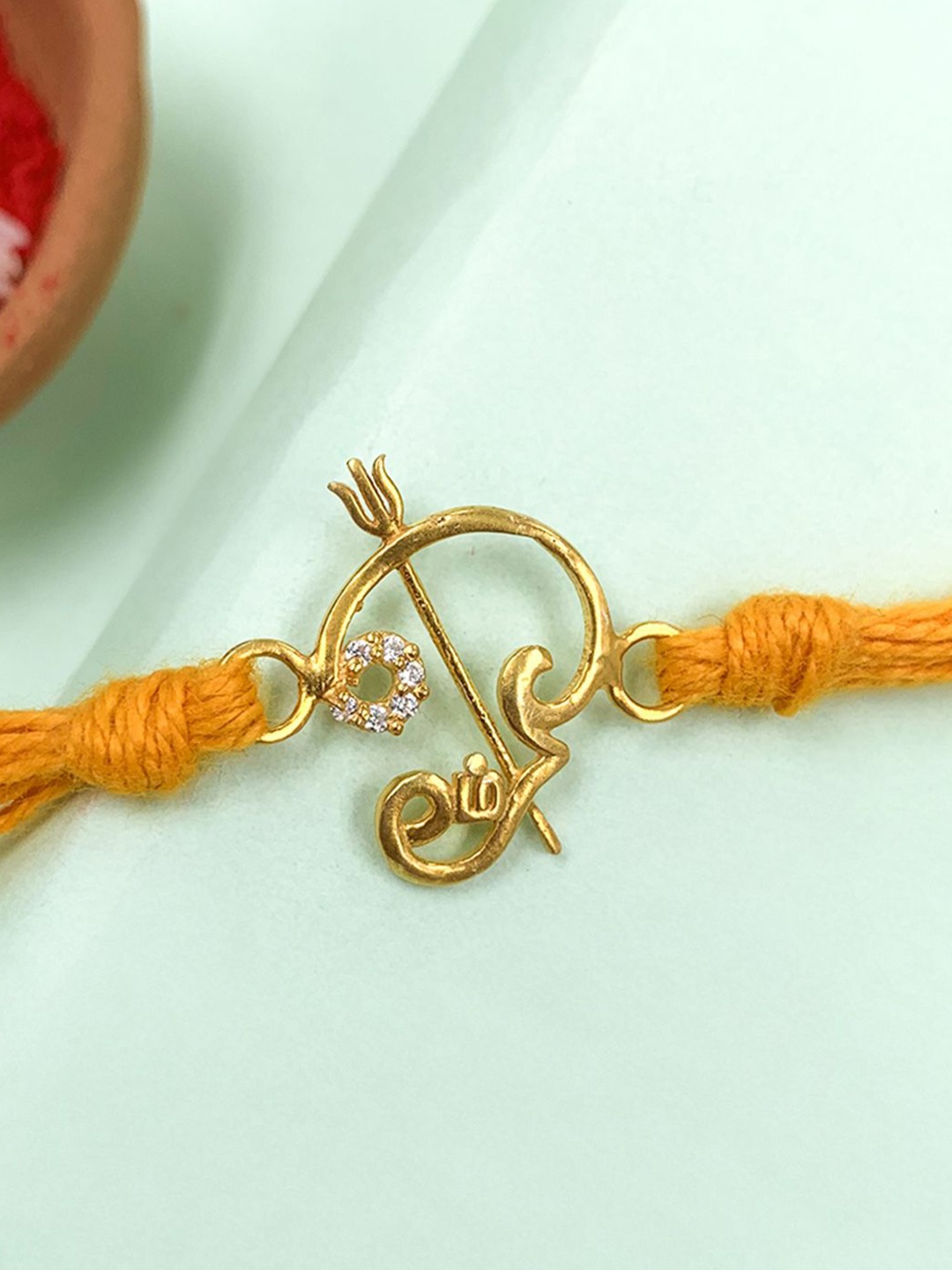 

Unniyarcha Thread Rakhi, Gold