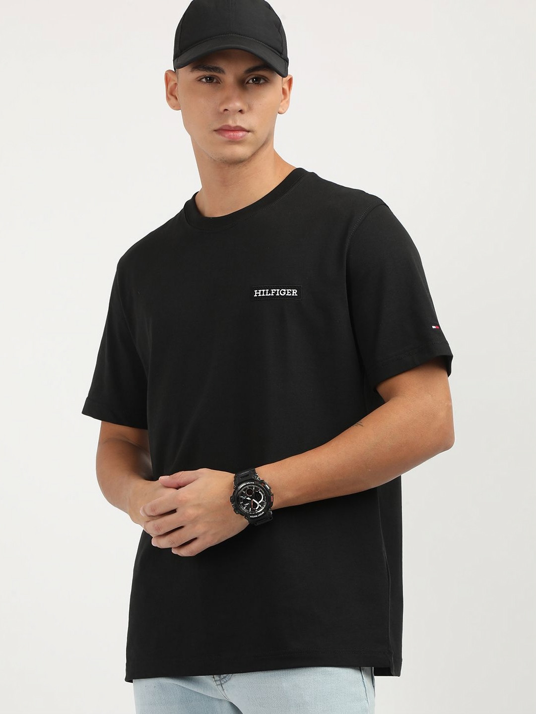 

Tommy Hilfiger Men Solid Round Neck Cotton T-Shirt, Black