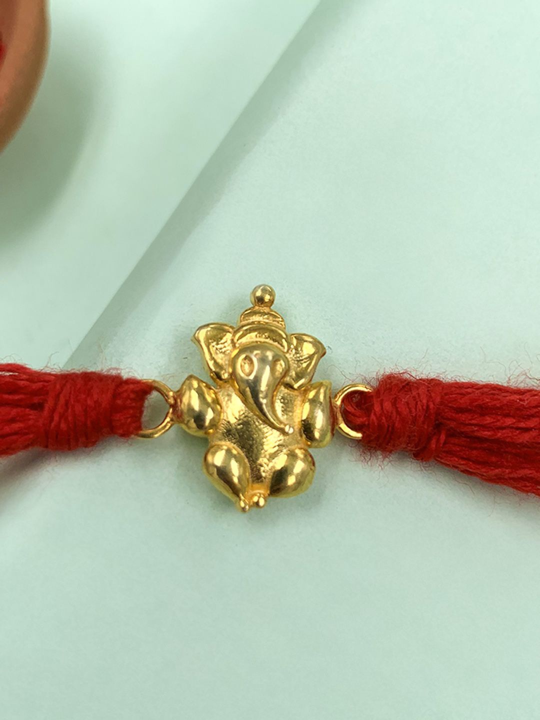 

Unniyarcha Thread Rakhi, Gold