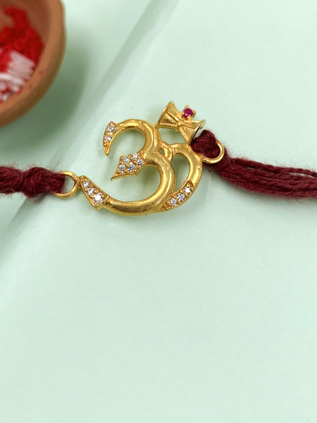

Unniyarcha Thread Rakhi, Gold
