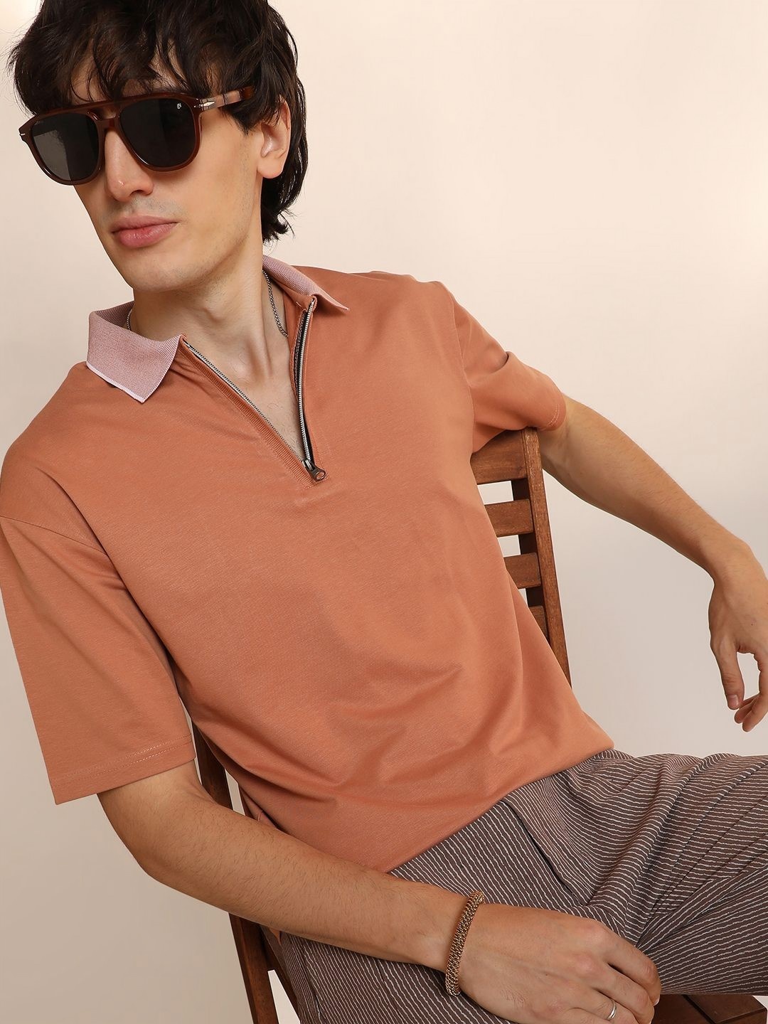 

Campus Sutra Men Solid Polo Collar Cotton T-shirt, Orange