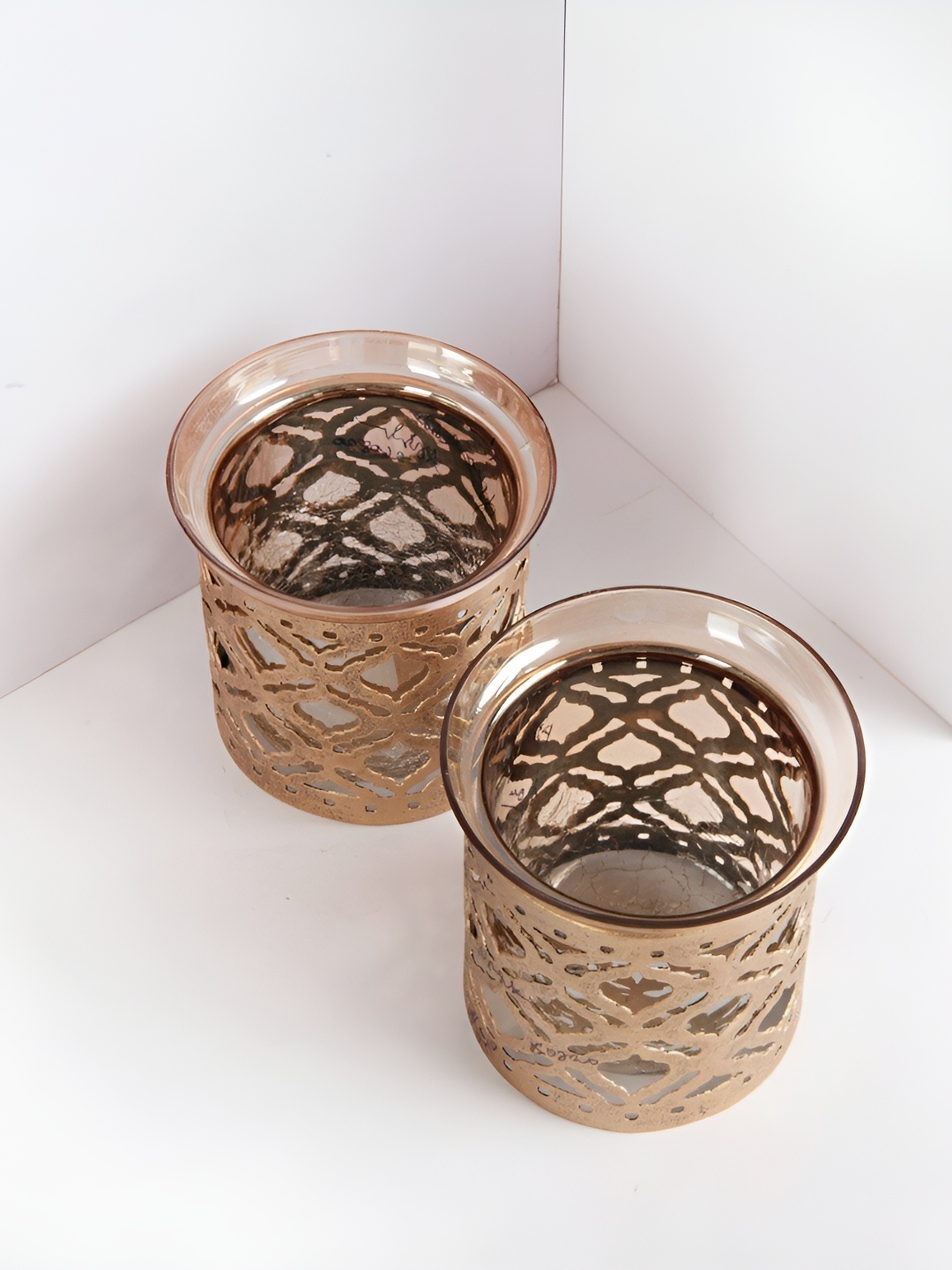 

Fabindia Gold-Toned 2 Pieces Metal Candle Holder