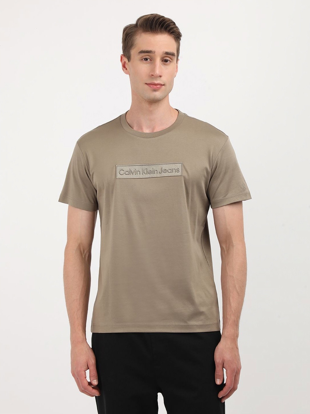 

Calvin Klein Jeans Men Typography Printed Round Neck Cotton T-shirt, Brown