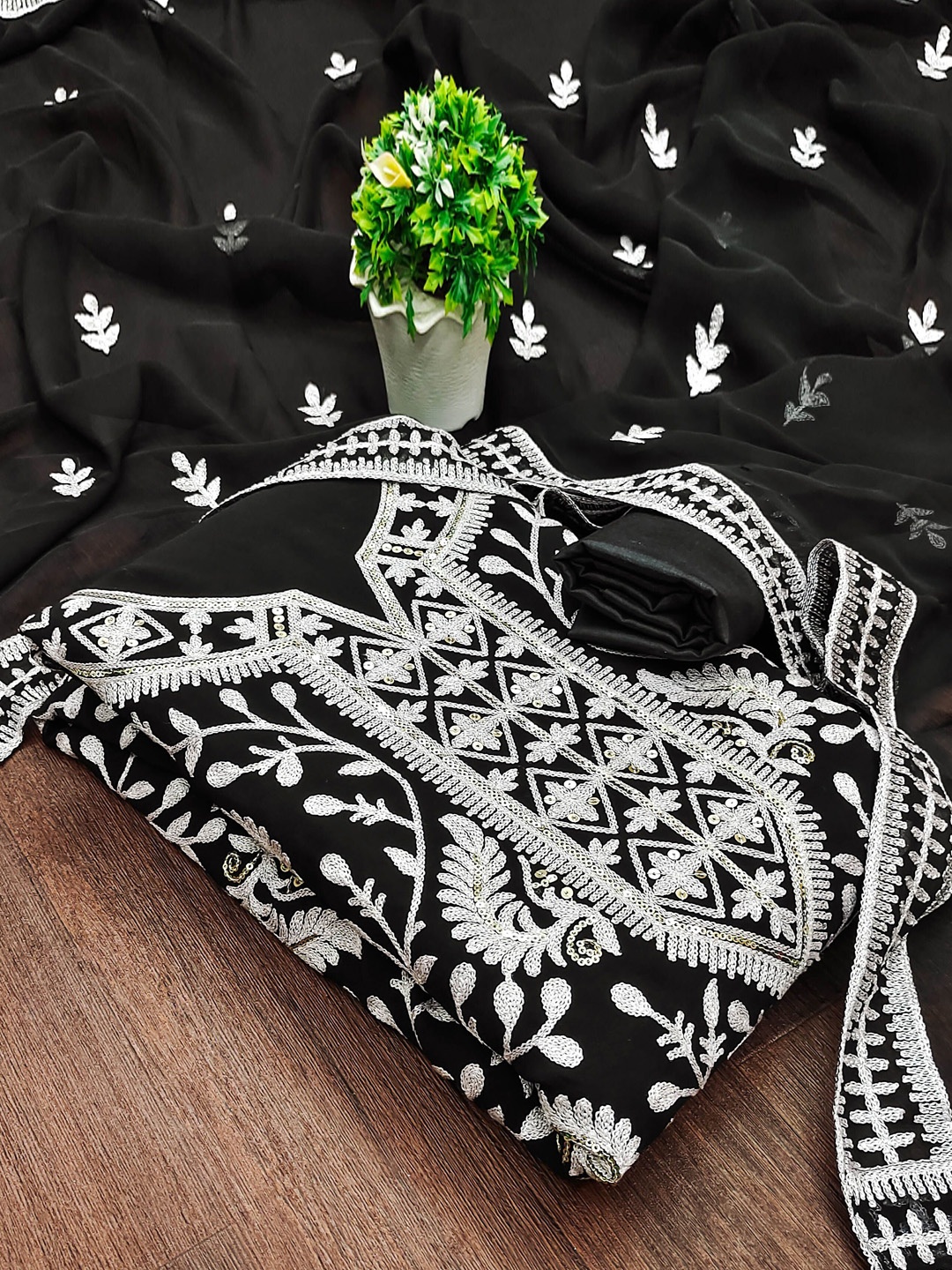 

Maroosh Floral Embroidered Sequinned Unstitched Dress Material, Black