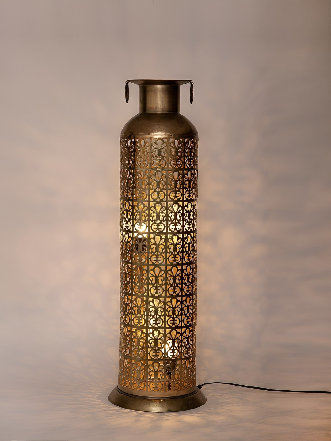 

Fabindia Utkrisht Gold Toned Bronze Textured Ambient Floor Lamp Without Shade