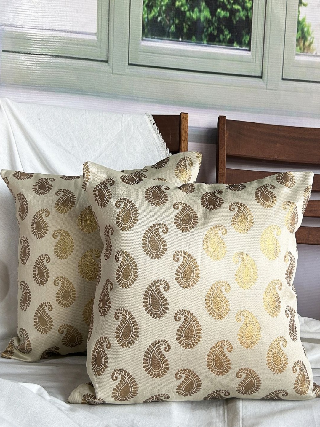 

Pink Parrot Cream Colored 2 Pieces Ethnic Motifs Printed Square Cushion Covers