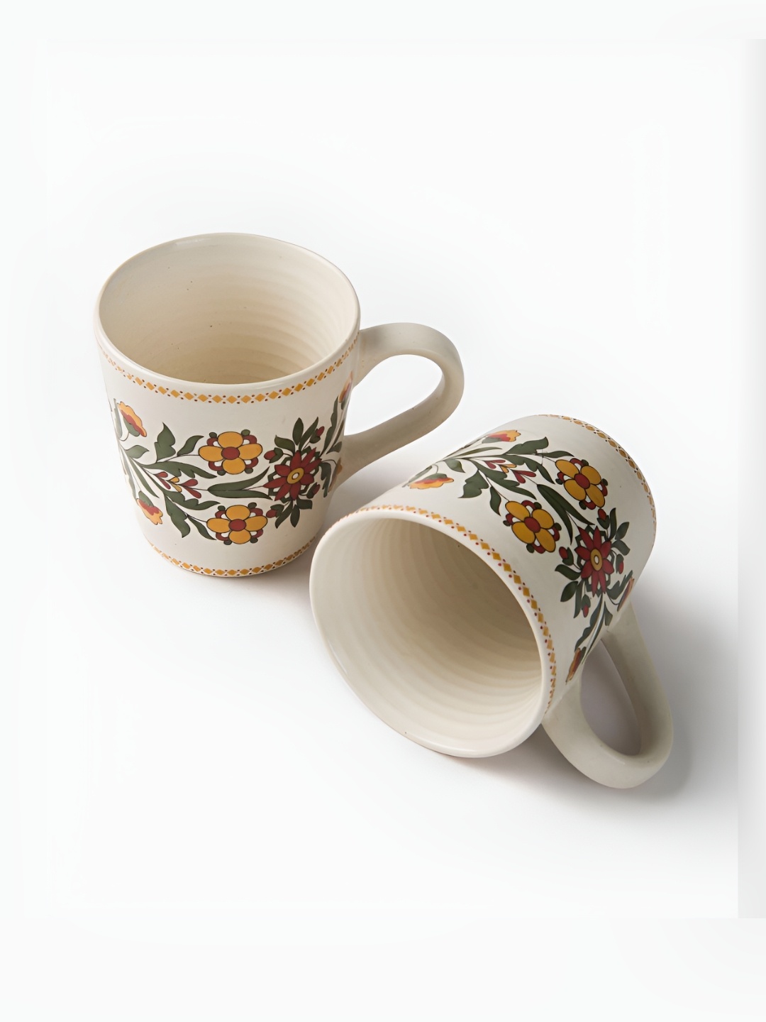 

Fabindia Pushp Off-White & Green 2 Pieces Floral Printed Ceramic Casted Mugs 280 ml Each