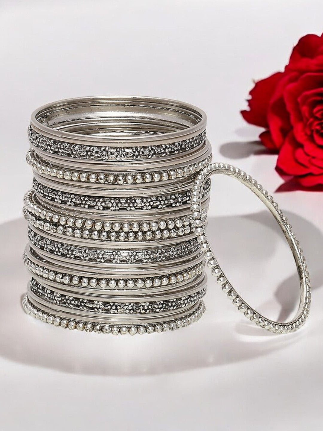 

Sangria Set Of 30 Oxidised Floral Design Bangles, Silver