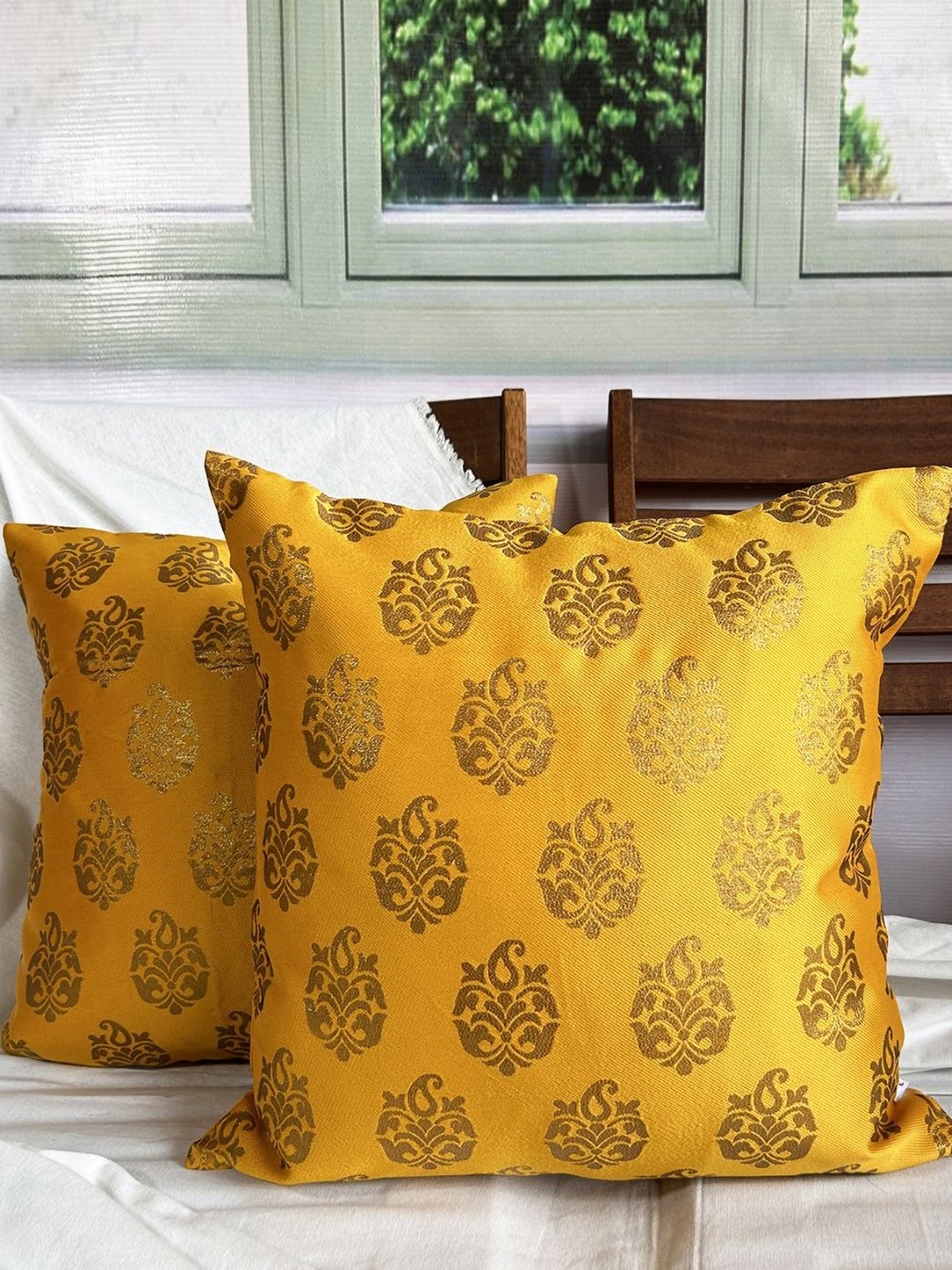 

Pink Parrot Yellow & Gold Toned 2 Pieces Ethnic Motifs Printed Square Cushion Covers