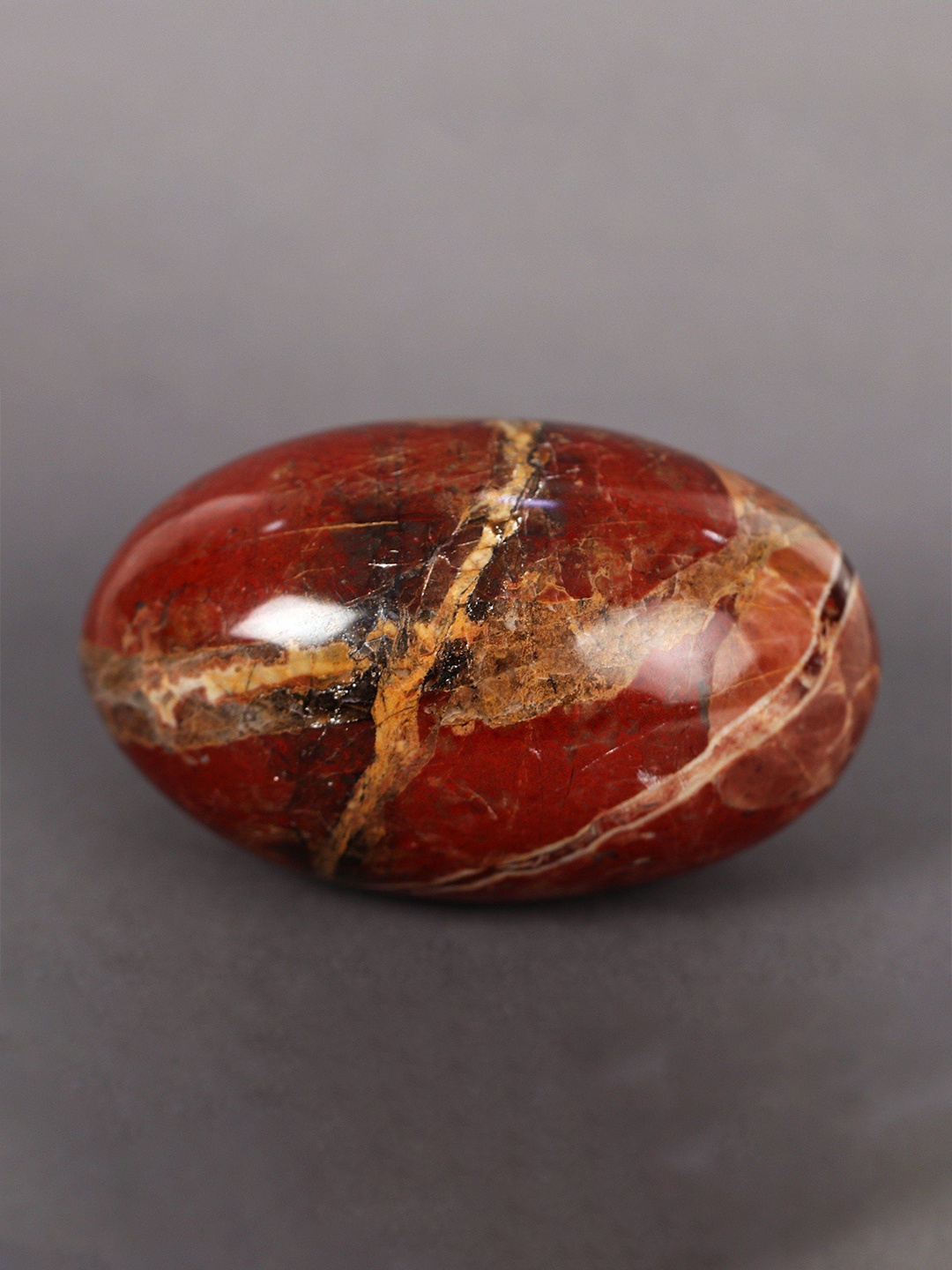 

Exotic India Red & Gold Toned Gemstone Curio Showpieces