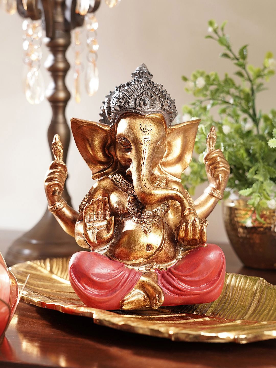

Pure Home and Living Red & Gold Toned Idol Religious Showpiece