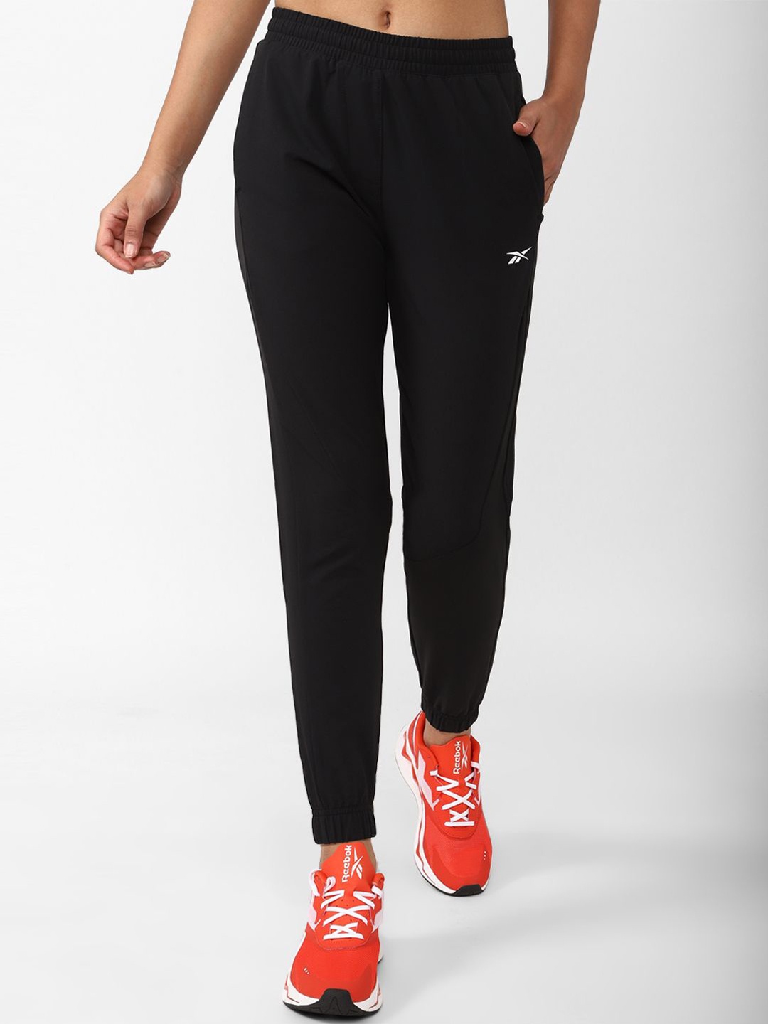 

Reebok Women TS COMM Woven Track Pant, Black