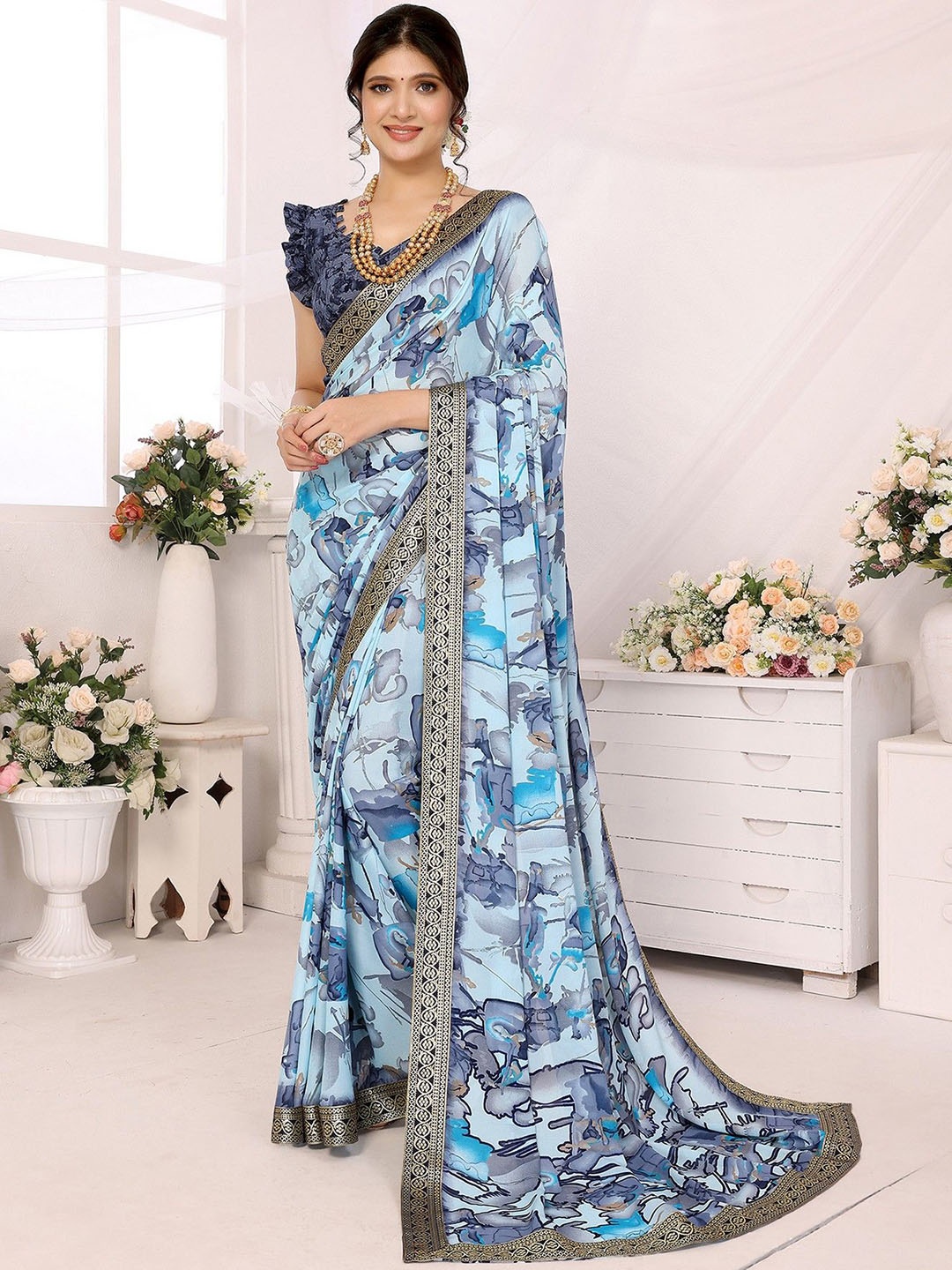 

KALINI Abstract Printed Embellished Border Saree, Blue