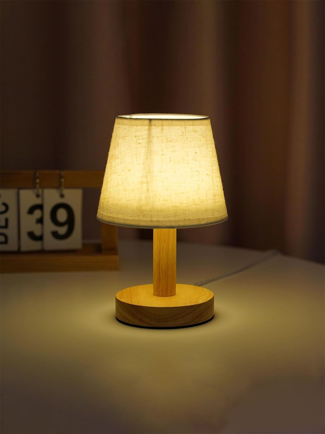 

Ekhasa Brown Textured Wooded Frustum Shaped Contemporary Table Lamps