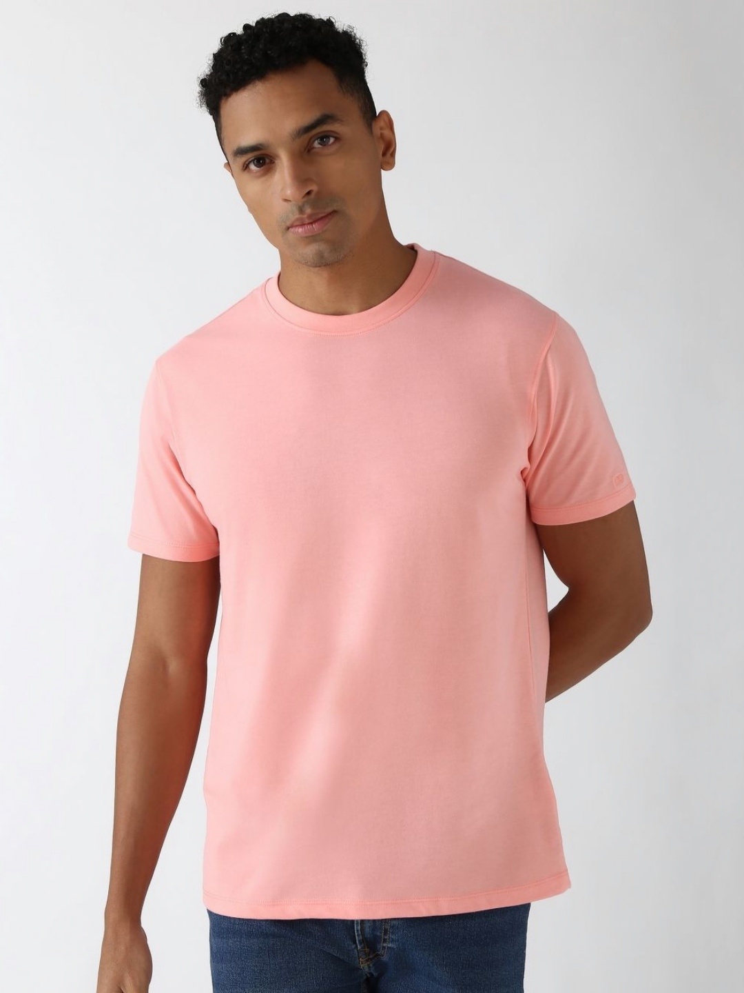 

Peter England Casuals Men Solid Round Neck Cotton T-Shirt, Peach