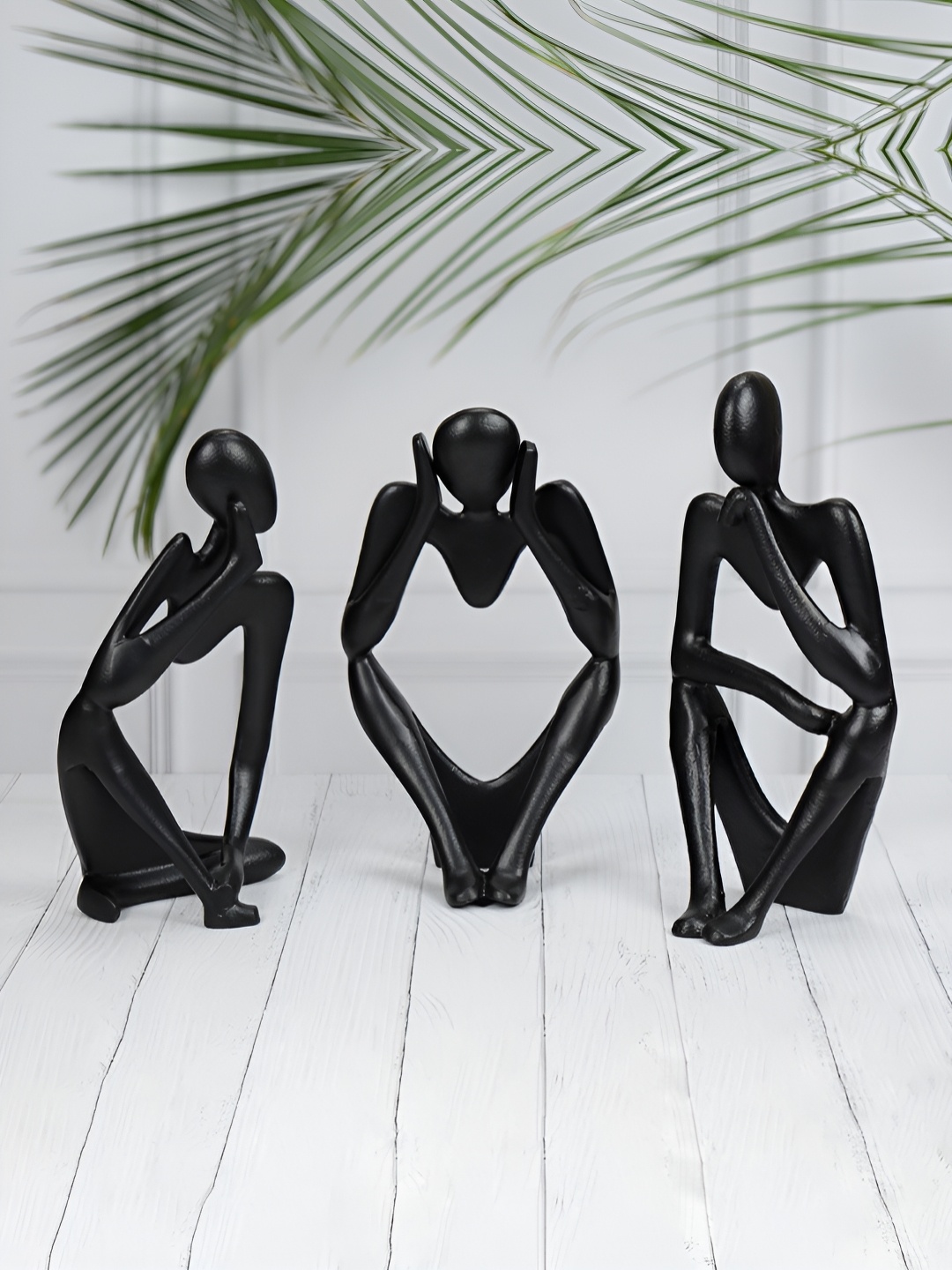 

Maison Modern Black 3 Pieces Hollow Man Sculpture Showpiece