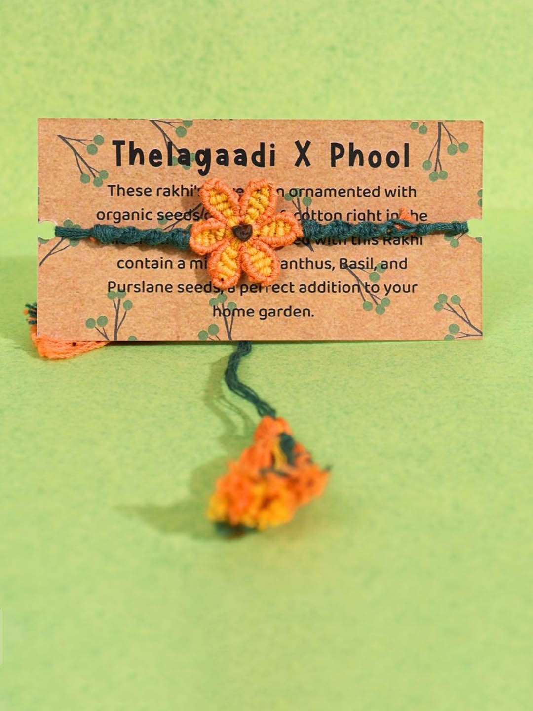 

Thela Gaadi Floral Thread Rakhi with Assorted Gifts, Yellow