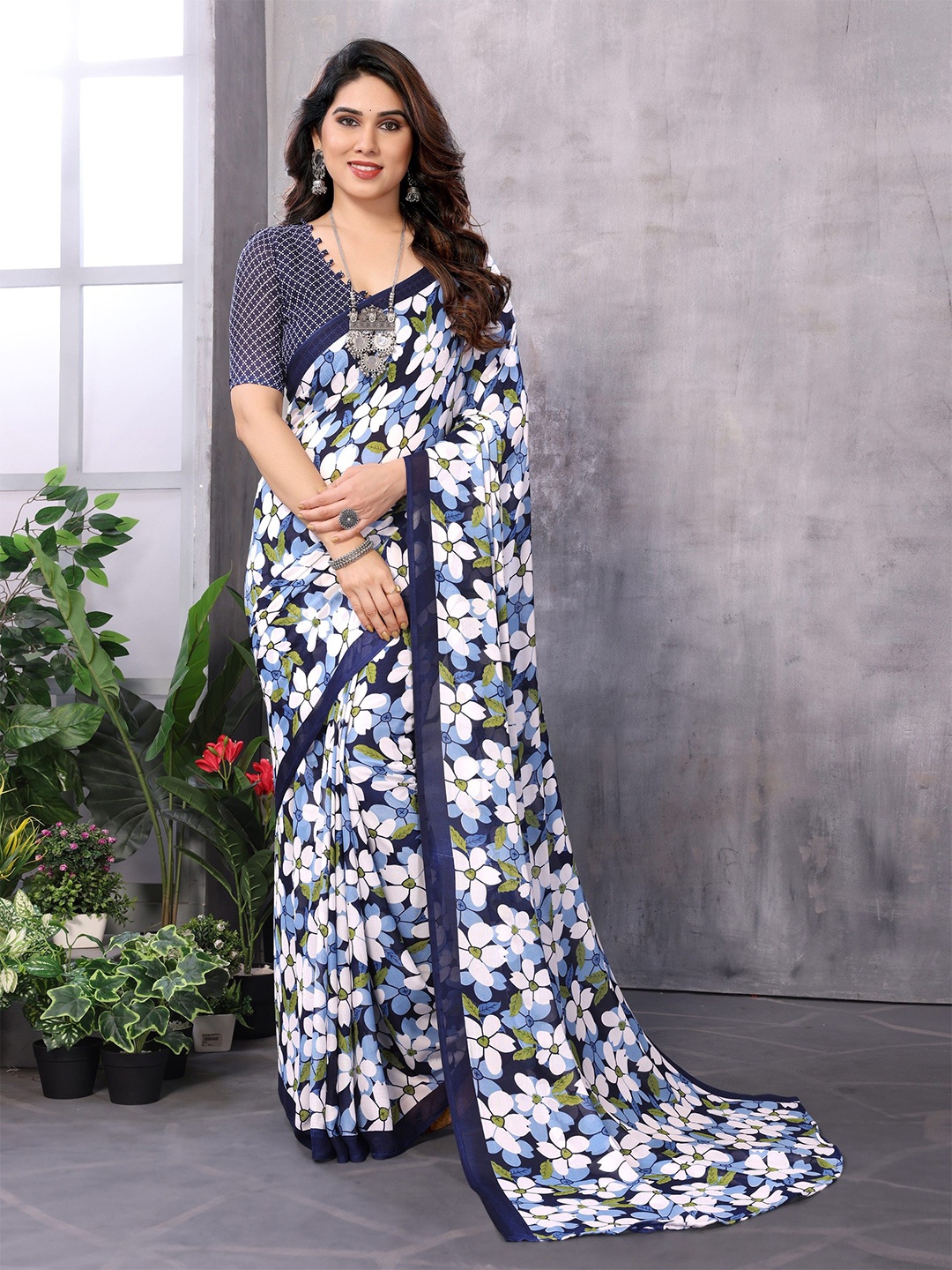 

Ambuja International Floral Poly Georgette Saree, Blue