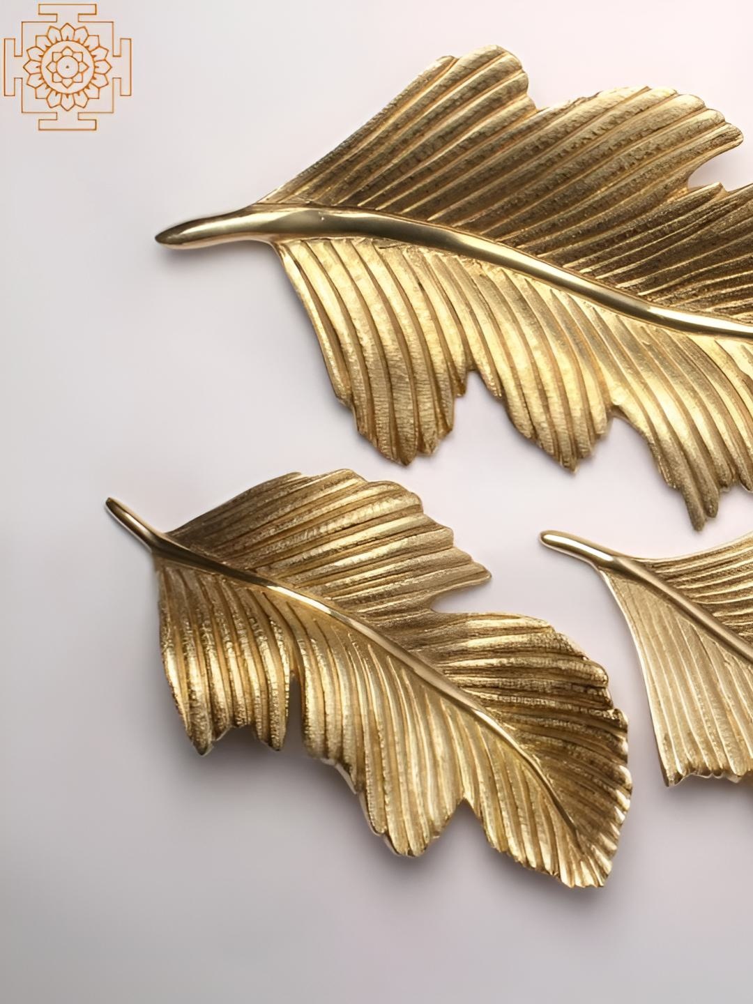 

Exotic India 17'' Brass Set of 3 Feather Of Birds Wall Hanging (Wall Decor), Gold