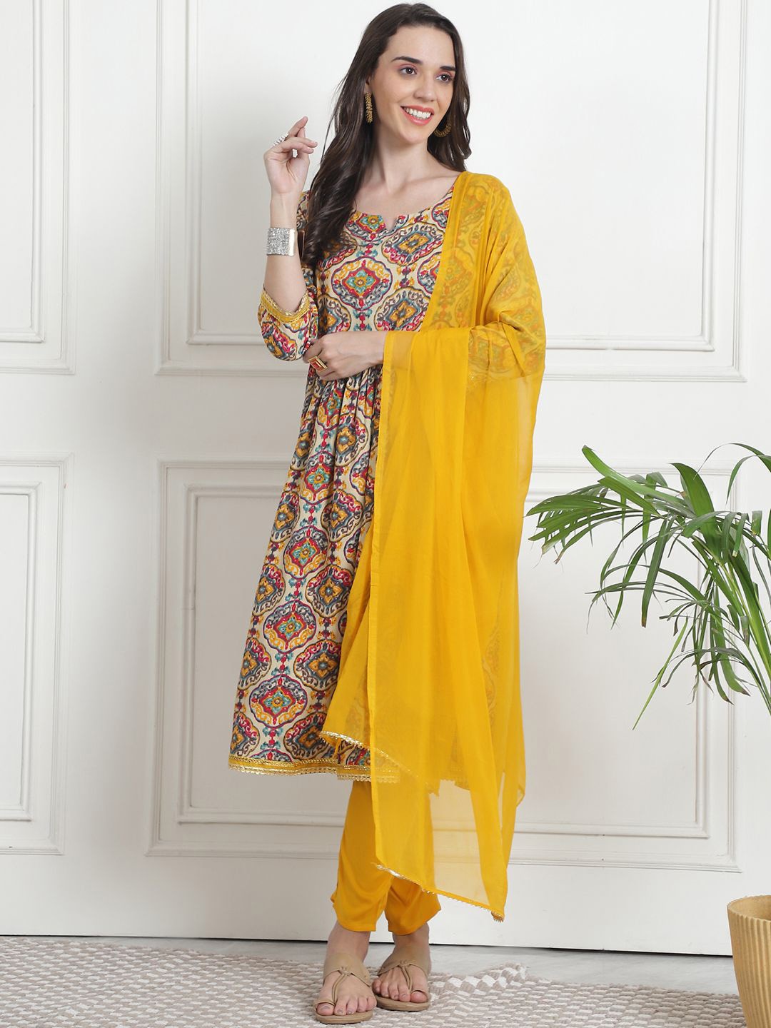 

KALINI Floral Printed Notch Neck A-Line Kurta With Trousers & Dupatta, Mustard