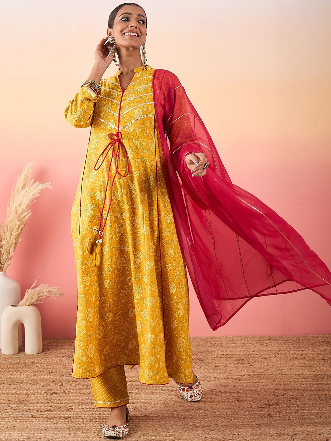 

Madhuni Floral Printed Gotta Patti Mandarin Collar A-Line Kurta With Palazzos & Dupatta, Mustard