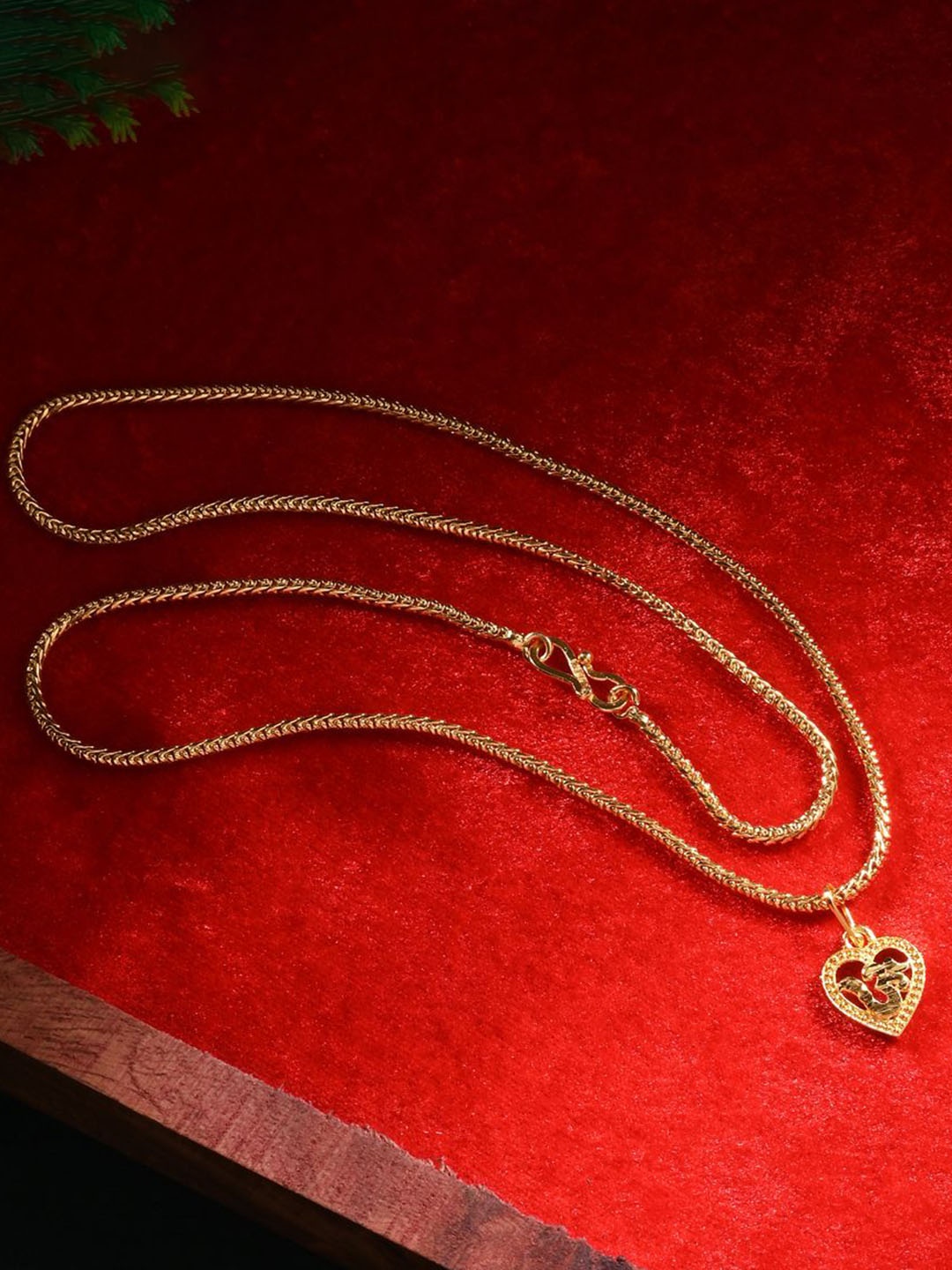 

AanyaCentric Gold-Plated Heart Shaped Om Pendant with Chain