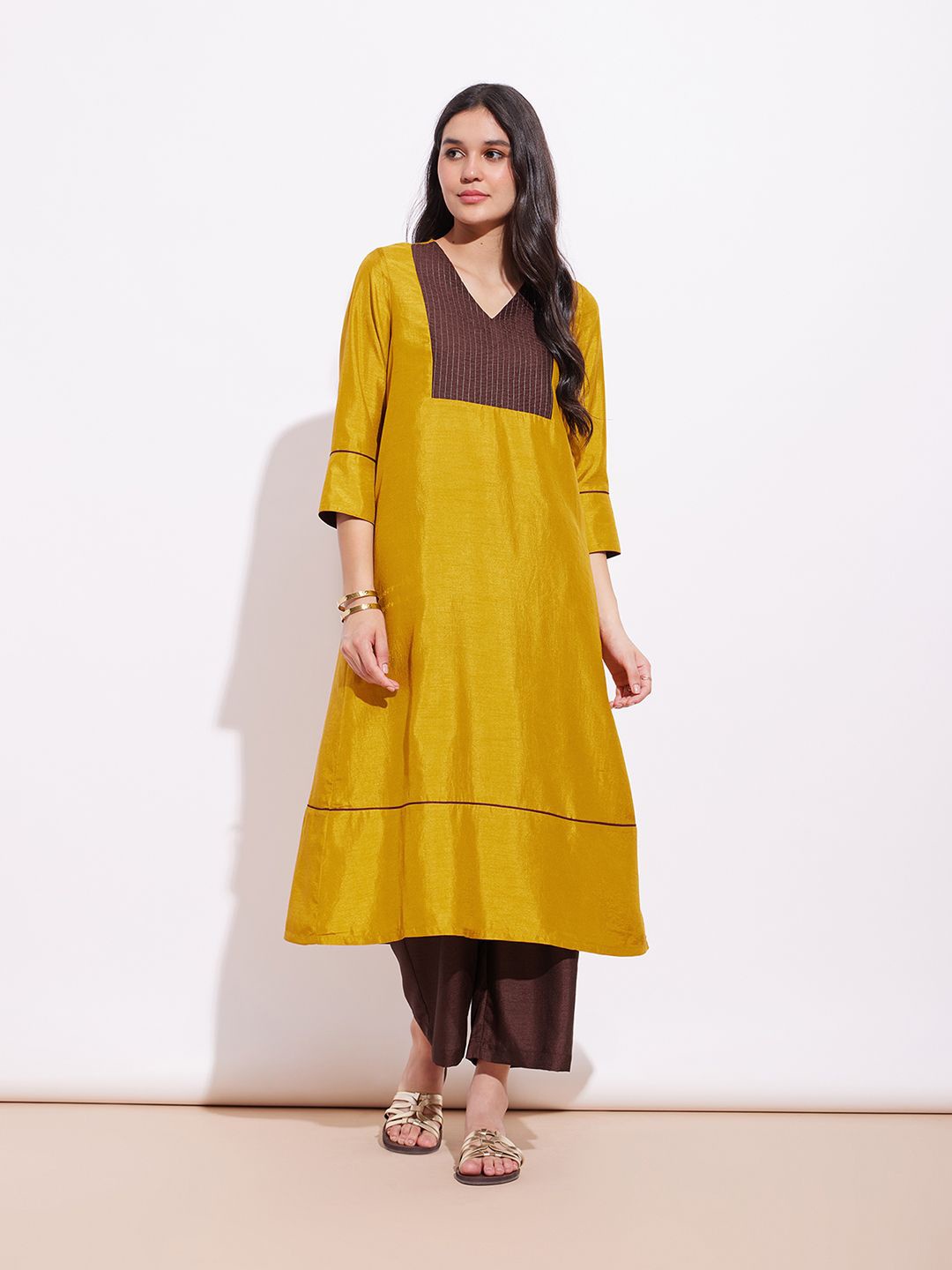 

Pink Fort Striped V-Neck A-Line Kurta with Trousers, Mustard